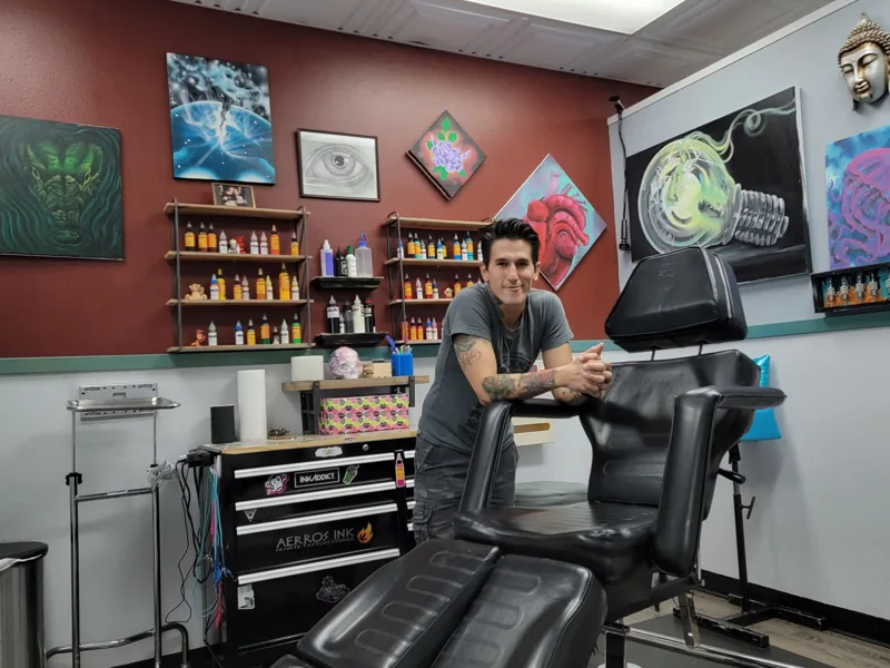 AJ in his private tattoo studio at Aerros Ink