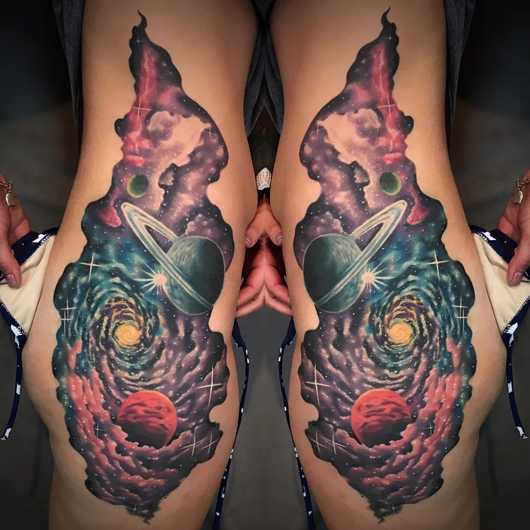 Color galaxy and planets tattoo on the forearm