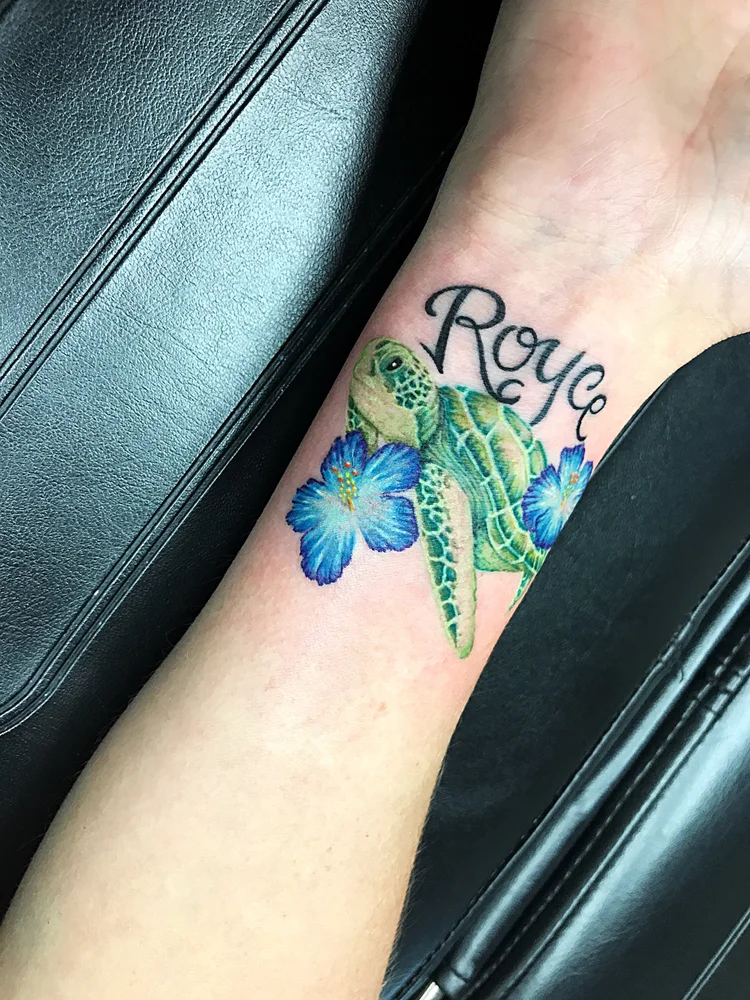 Script name with a sea turtle and blue flower