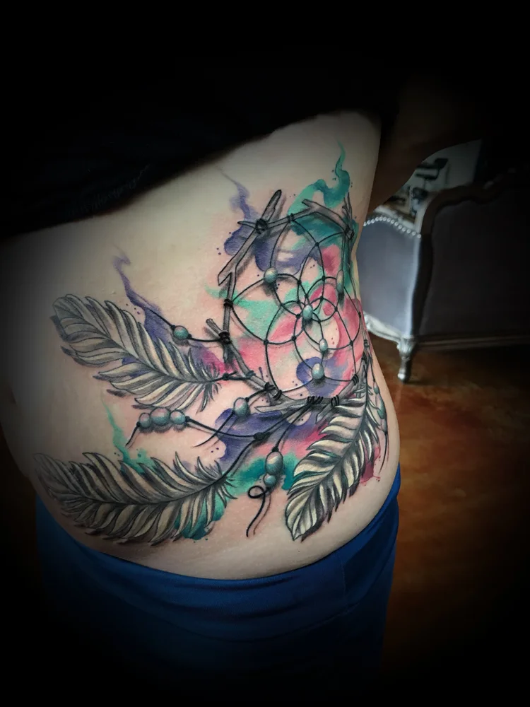 Watercolor dreamcatcher with feathers on the side