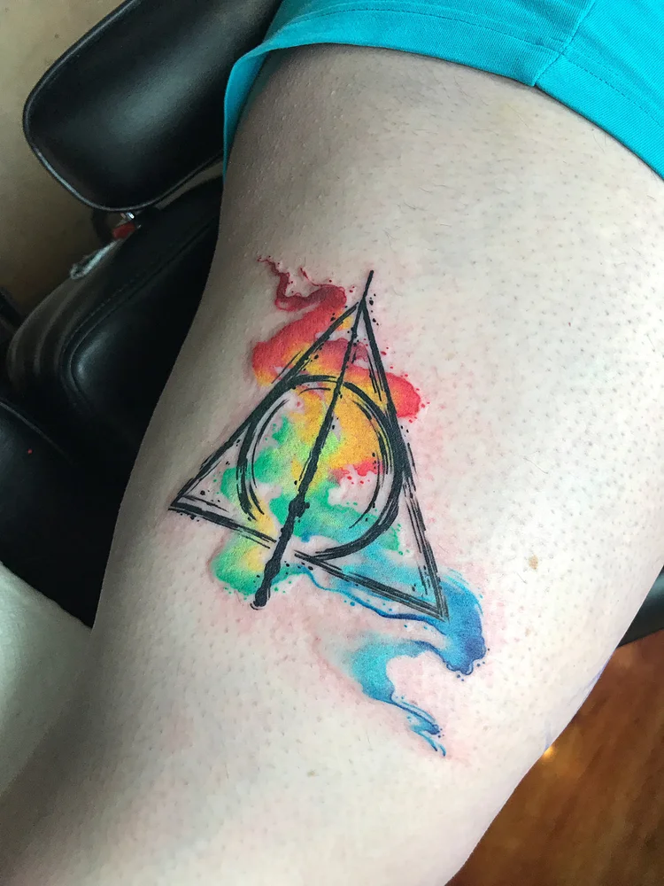 Watercolor triangle and circle symbol on the arm
