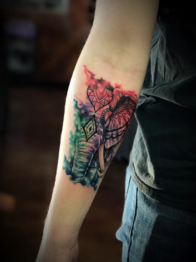 Watercolor geometric elephant on the forearm